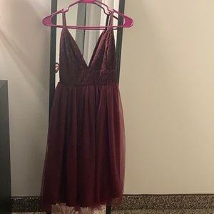 Burgundy tulle V-neck dress with thin straps.